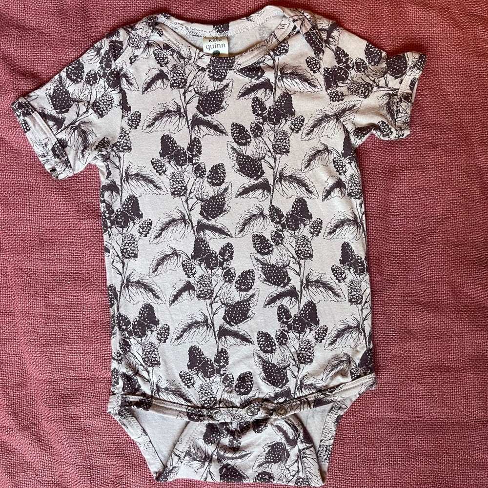 Kate Quinn blackberry bodysuit